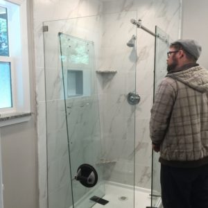 Showcase Shower Door Company installing a customer-supplied shower enclosure.